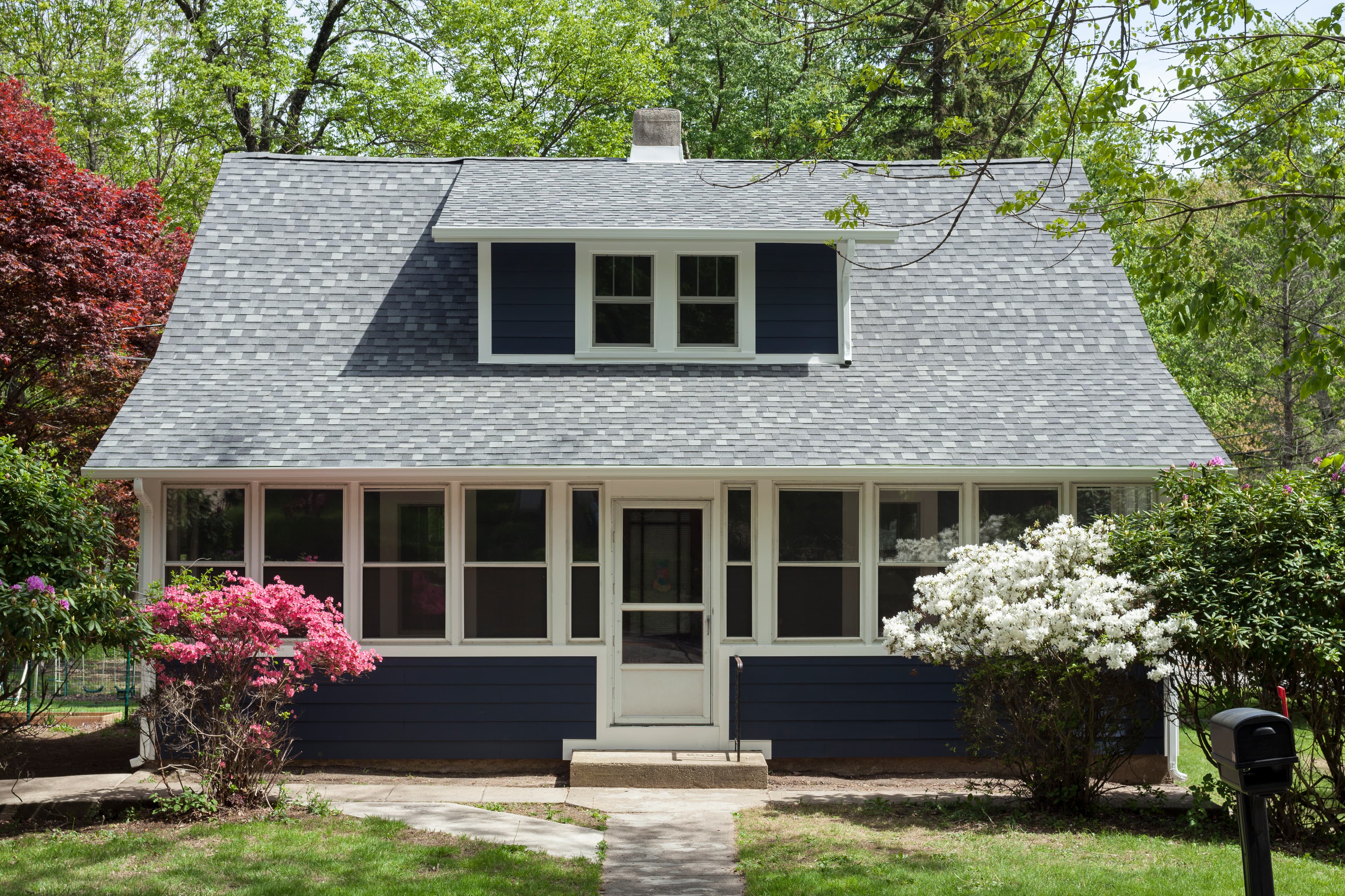 House clad with Hardie® Plank in Deep Ocean and Hardie® Soffit in Arctic White