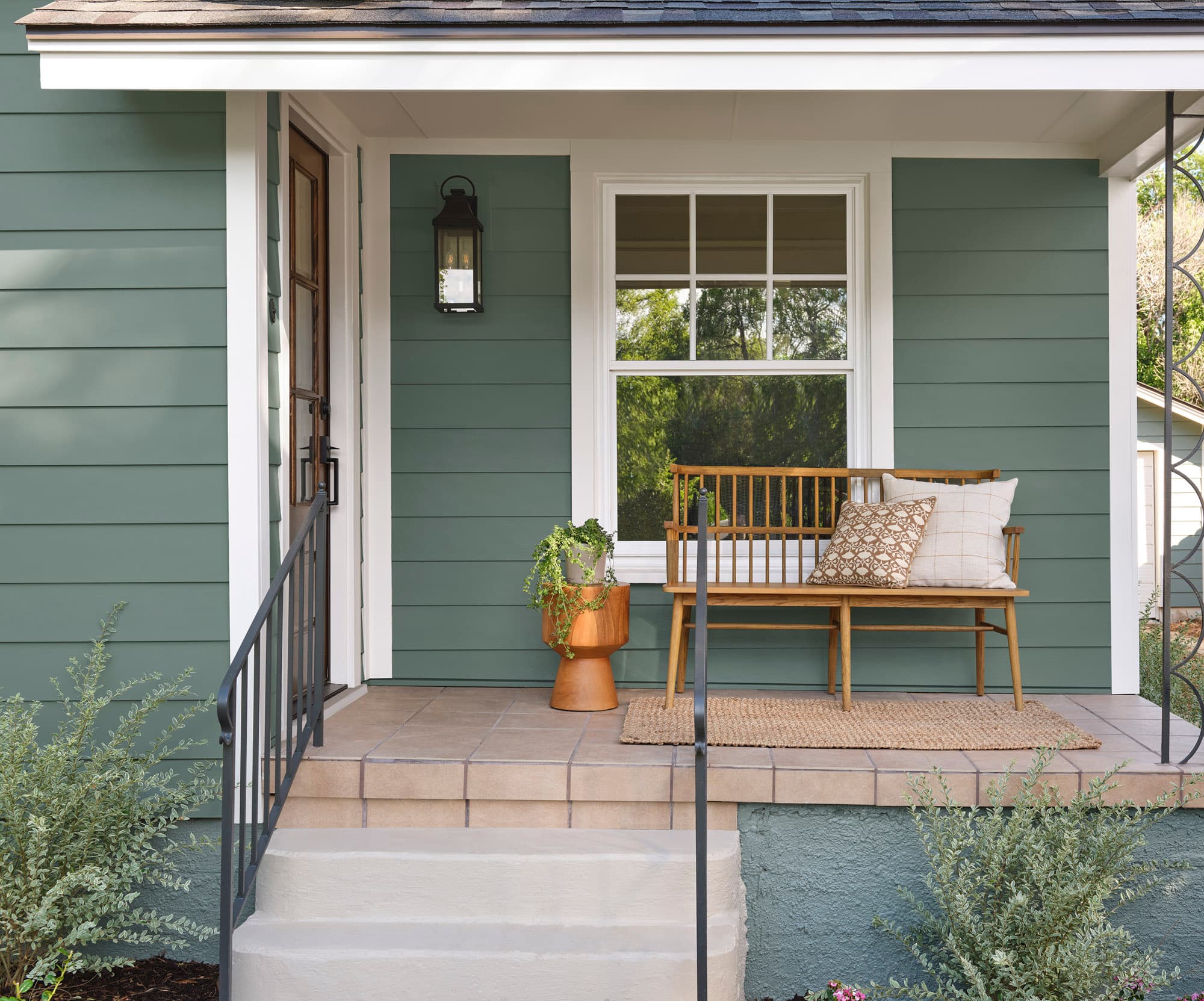 Porch featuring Chiseled Green Hardie® Plank lap siding, Smooth Texture 