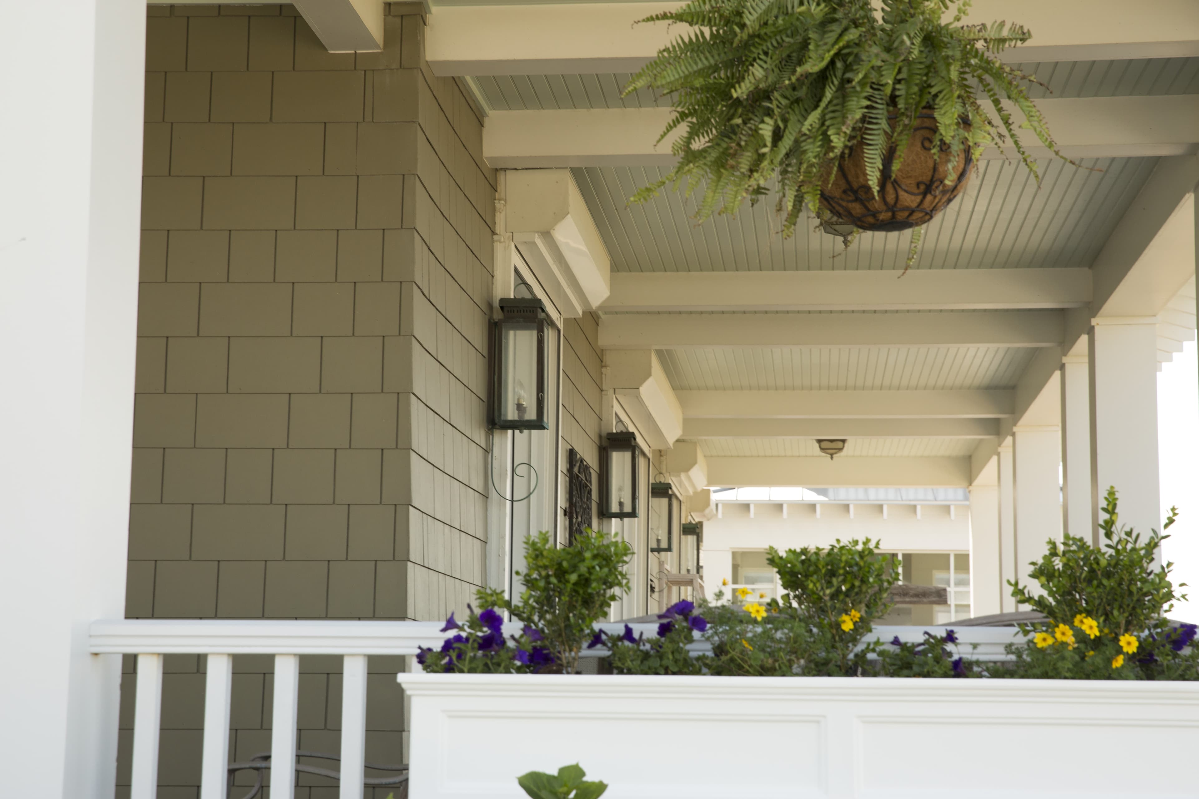 Large front porch detail with Hardie Shingle in Norfolk and field painted Hardie Trim in a custom color