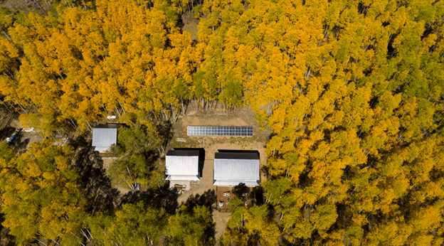 Home in Forest with Solar Panels