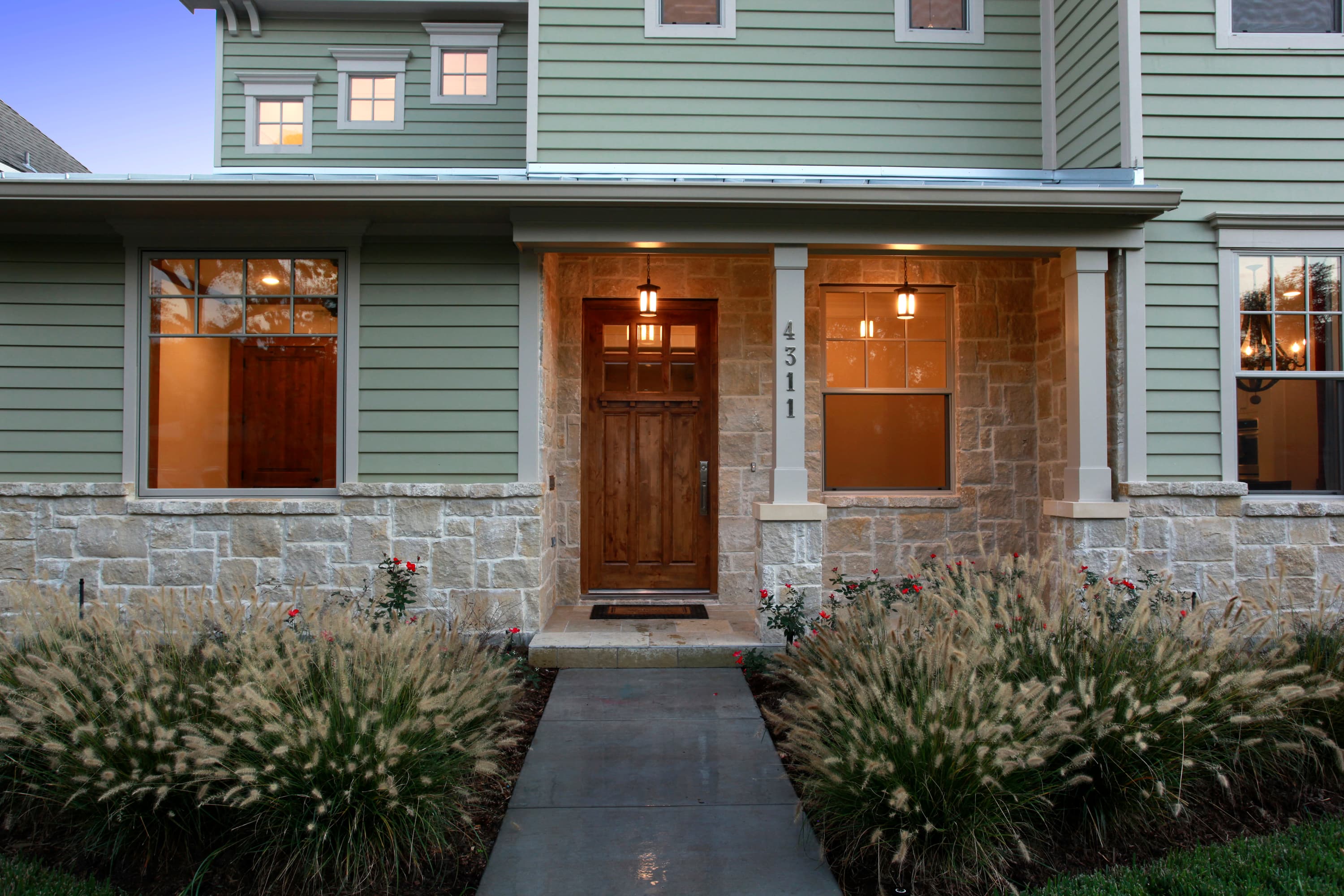 House clad with Hardie® Artisan Lap in Soft Green and Hardie® Artisan Trim in Arctic White