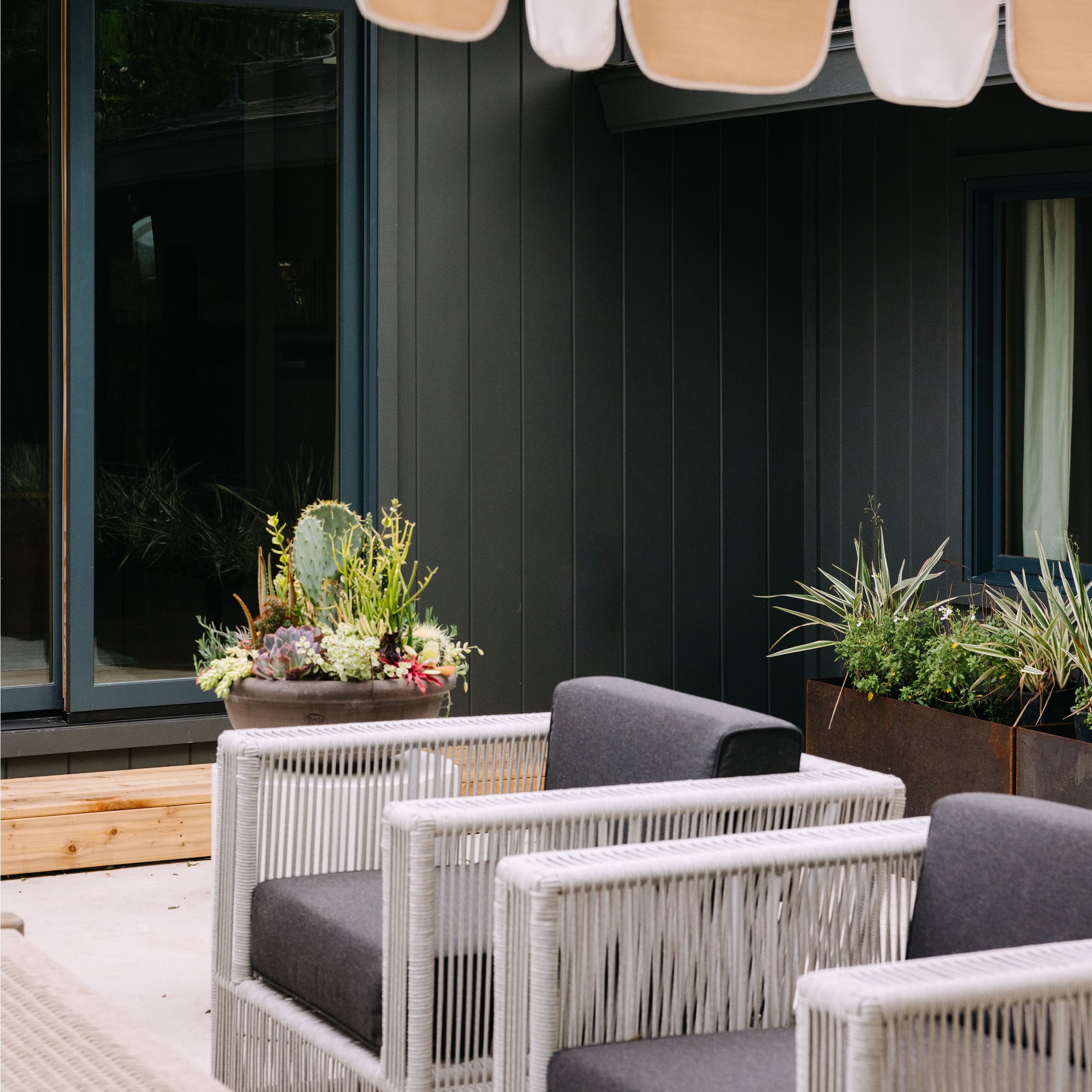 Kim Wolf patio featuring Hardie® Artisan® V-Groove installed vertically Kim Wolf patio featuring Hardie® Artisan® V-Groove installed vertically
